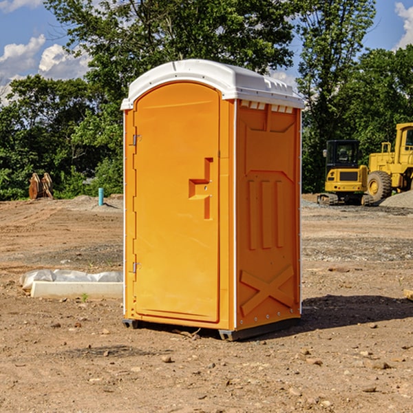 what is the cost difference between standard and deluxe portable restroom rentals in Hominy